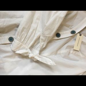 White button up shirt with fun detailing.